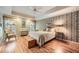Serene bedroom with tray ceilings, hardwood floors, and a calming color palette at 6520 Indian Acres Trl, Tucker, GA 30084