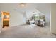 Large bedroom with two twin beds, carpeted floors, and an en-suite bathroom at 6520 Indian Acres Trl, Tucker, GA 30084