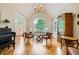 Bright living room featuring large window, hardwood floors, vaulted ceilings, and elegant chandelier at 6520 Indian Acres Trl, Tucker, GA 30084