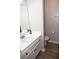 Bathroom featuring a white vanity with a sink and a toilet in a separate area at 9130 Charlton Pl, Douglasville, GA 30135