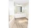 Bright bathroom showcasing a double sink vanity and separate soaking tub at 9130 Charlton Pl, Douglasville, GA 30135