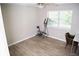 Bright bedroom featuring durable hardwood floors and ample natural light from a large window at 9130 Charlton Pl, Douglasville, GA 30135