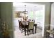 Dining room features large windows, a modern chandelier, and seating for six at 9130 Charlton Pl, Douglasville, GA 30135