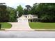 Inviting two-story home featuring a welcoming front porch and an attached two-car garage with a spacious driveway at 9130 Charlton Pl, Douglasville, GA 30135