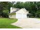 Attractive two-story home with a front-facing two-car garage, manicured lawn, and inviting porch at 9130 Charlton Pl, Douglasville, GA 30135