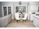 Eat-in kitchen with hardwood floors, modern finishes, and bright natural light at 9130 Charlton Pl, Douglasville, GA 30135