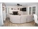 Living room with fireplace, hardwood floors, modern furniture, and natural light at 9130 Charlton Pl, Douglasville, GA 30135