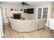Inviting living room with a comfortable sectional sofa, fireplace, and natural light from the sliding glass doors at 9130 Charlton Pl, Douglasville, GA 30135