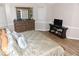 Main bedroom features hardwood floors, ensuite access and large windows for plenty of natural light at 9130 Charlton Pl, Douglasville, GA 30135