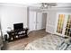 Main bedroom features hardwood floors, ensuite access and large windows for plenty of natural light at 9130 Charlton Pl, Douglasville, GA 30135
