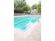 Community pool provides a refreshing escape, framed by lush landscaping and comfortable seating areas at 9130 Charlton Pl, Douglasville, GA 30135