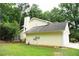 View of the home's rear exterior highlighting the well-kept lawn and exterior color at 9130 Charlton Pl, Douglasville, GA 30135