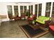 Relaxing sunroom with comfortable wicker seating, large windows, and serene views of the outdoor landscape at 9130 Charlton Pl, Douglasville, GA 30135