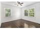 Bedroom with hardwood floors, ceiling fan, and windows that let in natural light at 2358 Armand Ne Rd, Atlanta, GA 30324