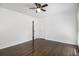 A spacious bedroom with hardwood floors, ceiling fan, and neutral paint at 2358 Armand Ne Rd, Atlanta, GA 30324
