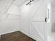 Walk-in closet with hardwood floors, wire shelving and barn door access at 2358 Armand Ne Rd, Atlanta, GA 30324