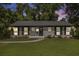 Single story home with a brick exterior, well-kept lawn, and neatly trimmed hedges at 2358 Armand Ne Rd, Atlanta, GA 30324