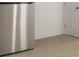 A stainless steel refrigerator with a light wood colored floor at 2358 Armand Ne Rd, Atlanta, GA 30324