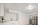 A kitchen with a stainless steel refrigerator, white cabinets and a white counter top at 2358 Armand Ne Rd, Atlanta, GA 30324