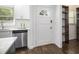 Close up of a modern, bright kitchen featuring stainless steel appliances and white cabinets and grey countertops at 2358 Armand Ne Rd, Atlanta, GA 30324