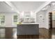 Bright open kitchen with a center island, stainless steel appliances, and hardwood floors at 2358 Armand Ne Rd, Atlanta, GA 30324