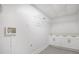 A laundry room featuring white cabinets and modern shelving at 2358 Armand Ne Rd, Atlanta, GA 30324