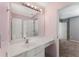Bathroom featuring a vanity countertop, large mirror, and neutral color palette at 2667 Hampton Park Dr, Marietta, GA 30062