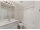 Bright bathroom with a white vanity, toilet, and tub/shower combo at 2667 Hampton Park Dr, Marietta, GA 30062