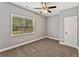 Bedroom with a ceiling fan, natural light from the window, and plush carpet at 2667 Hampton Park Dr, Marietta, GA 30062