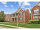 Two-story brick home with a manicured lawn and inviting front porch, located in a desirable neighborhood at 2667 Hampton Park Dr, Marietta, GA 30062