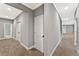 Hallway featuring neutral walls, carpet flooring, and multiple entry points at 2667 Hampton Park Dr, Marietta, GA 30062