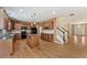 Well-equipped kitchen with wood cabinets, a center island, and hardwood floors, connecting to the living area at 2667 Hampton Park Dr, Marietta, GA 30062