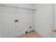 A basic laundry room with a wire shelf and visible utility connections at 2667 Hampton Park Dr, Marietta, GA 30062