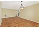 An open-concept living room features hardwood floors and a modern light fixture at 2667 Hampton Park Dr, Marietta, GA 30062