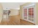 Spacious living room featuring hardwood floors, neutral walls, and elegant french doors at 2667 Hampton Park Dr, Marietta, GA 30062