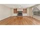 Bright living room featuring a brick fireplace, built-in bookshelves, hardwood floors, and a ceiling fan at 2667 Hampton Park Dr, Marietta, GA 30062