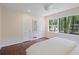 Bright bedroom with hardwood floors, double closets, and large windows with a view at 2800 Mornington Nw Dr, Atlanta, GA 30327