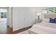 Comfortable bedroom with natural light, bench seat, and a doorway to a sunroom at 2800 Mornington Nw Dr, Atlanta, GA 30327