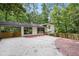 Home exterior showcasing a private driveway, carport, and attractive landscaping at 2800 Mornington Nw Dr, Atlanta, GA 30327