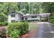 Charming single-story home with white painted brick, manicured landscaping, and covered parking at 2800 Mornington Nw Dr, Atlanta, GA 30327