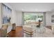 Bright living room with hardwood floors, neutral furniture, and view to the wooded outdoors at 2800 Mornington Nw Dr, Atlanta, GA 30327