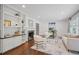 Spacious living room with fireplace, built-in bookshelves, and hardwood floors at 2800 Mornington Nw Dr, Atlanta, GA 30327