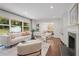 Bright and open living room with hardwood floors, fireplace, and views to the dining room at 2800 Mornington Nw Dr, Atlanta, GA 30327