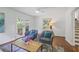 Cozy living room features French doors, hardwood flooring, and tasteful decor at 2800 Mornington Nw Dr, Atlanta, GA 30327