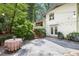 Lovely outdoor stone patio featuring string lights, lush greenery, and an inviting seating area at 2800 Mornington Nw Dr, Atlanta, GA 30327