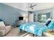 Bright bedroom featuring a queen bed, mirrored closet doors, and soft blue walls with white trim at 3251 Abbeywood Dr, Decatur, GA 30034