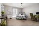 Spacious bedroom with neutral walls, floral bedding, a large window, and eclectic furnishings at 3251 Abbeywood Dr, Decatur, GA 30034