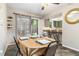 Dining area with a view to the kitchen and access to the backyard at 3251 Abbeywood Dr, Decatur, GA 30034
