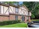 Charming brick townhome with Tudor-style accents and well-manicured landscaping offers classic appeal at 3251 Abbeywood Dr, Decatur, GA 30034