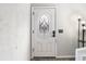 The white front door features an oval glass insert and is complemented by a modern light fixture at 3251 Abbeywood Dr, Decatur, GA 30034